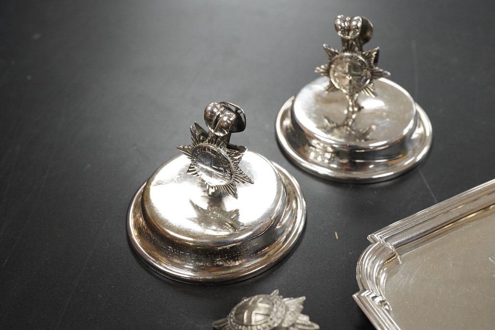 A pair of late Victorian Regimental silver menu holders (Royal Sussex Regiment), a pair of ashtrays and two pairs of uniform pips first height 5cm., weight approx. 7.83ozt